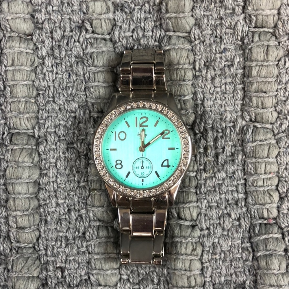 Elegant Silver Women's Watch with Turquoise Dial